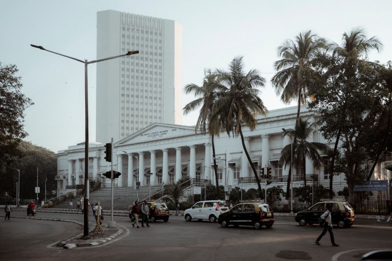 The architectural beauty of Mumbai's historic Asiatic Society Library surrounded by palm trees