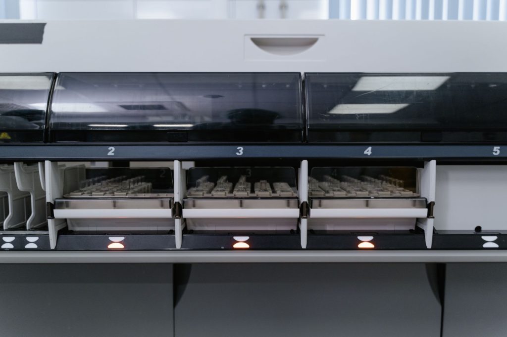 A scientist examines medical technology in a lab setting