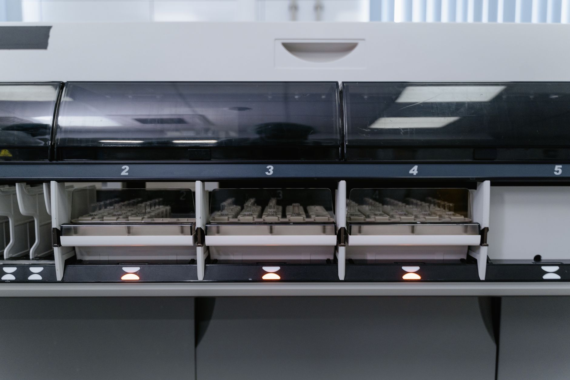 A scientist examines medical technology in a lab setting