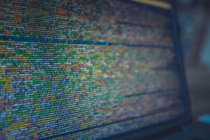 A detailed view of colorful source code displayed on a computer screen, representing modern programming and technology