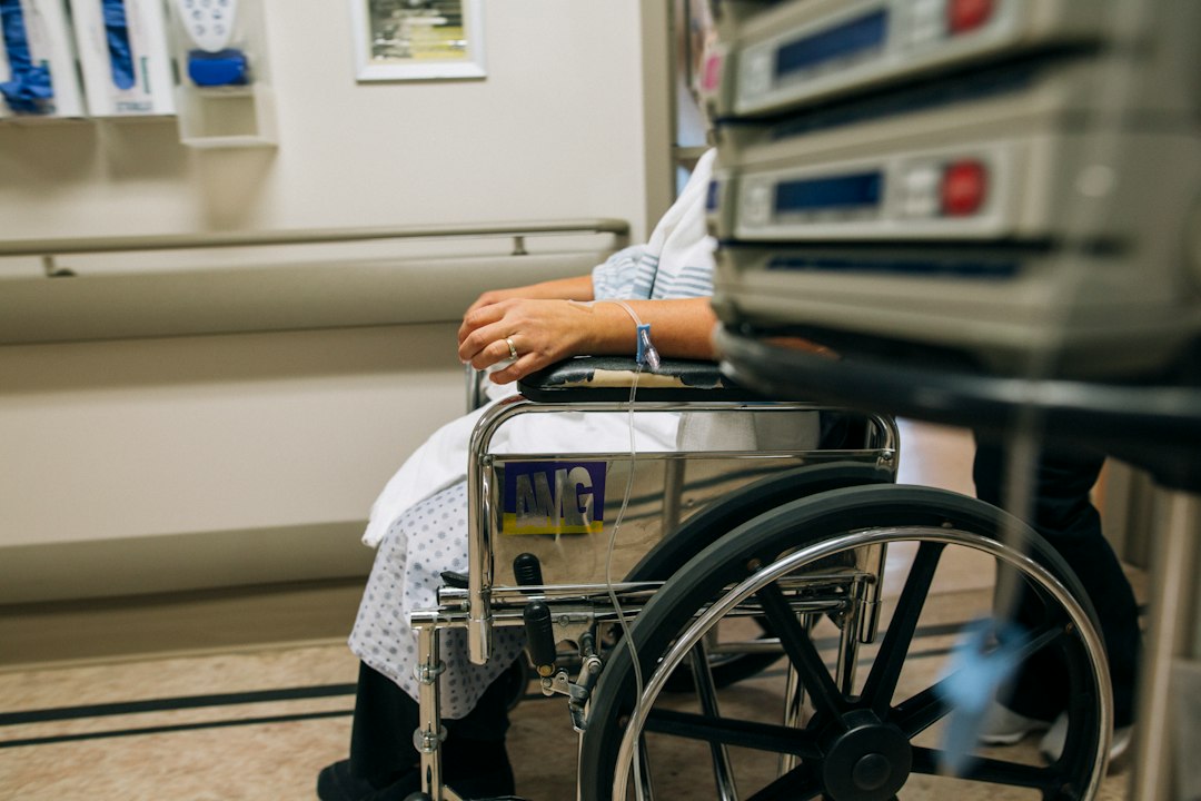 a woman sitting in a wheel chair in a hospital