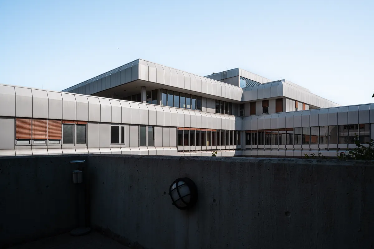 A modern building exterior, used as an illustrative research setting