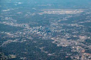 Aerial photograph showcasing the bustling skyline of Charlotte, North Carolina amidst green landscapes